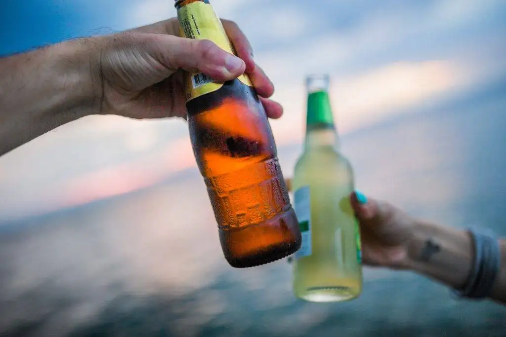 Cheers beach beer bottleman hand oppressing - David Hunter Law Firm