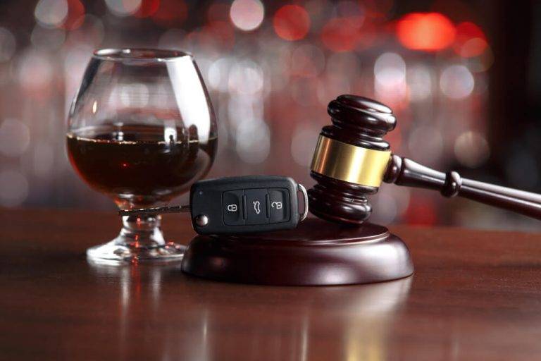 criminal defense attorney near me for dui cases - gavel, car keys and snifter of alcohol